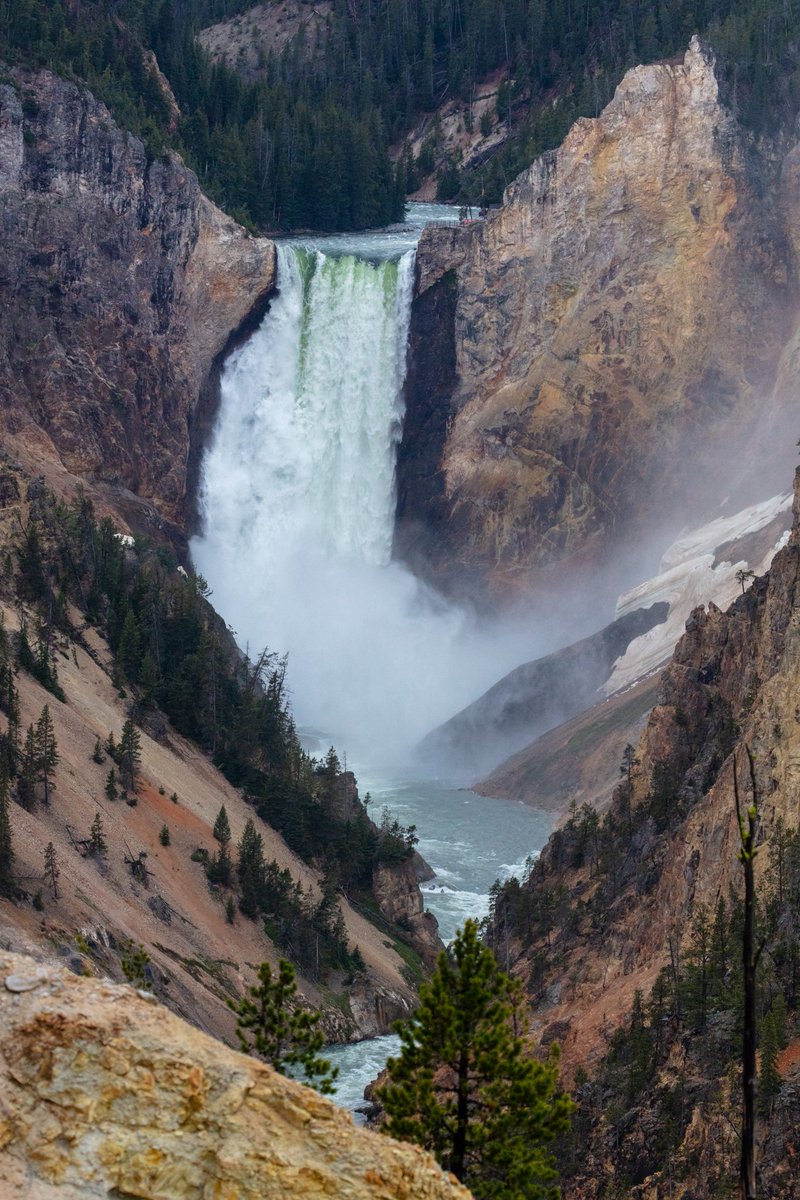 A large waterfall and canyon seen from a distance.