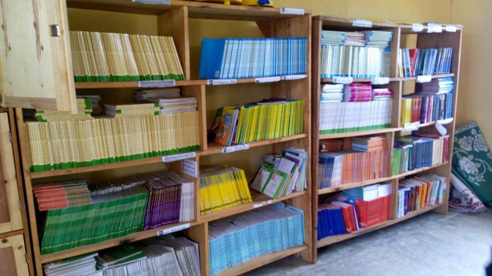 mwasa's tweet photo. 80yr-old Mukansanga Ferediyana is a regular at this local library in Nyaruguru district. She can only read Kinyarwanda books but wants to able to read foreign languages https://t.co/gj89G7HT1n