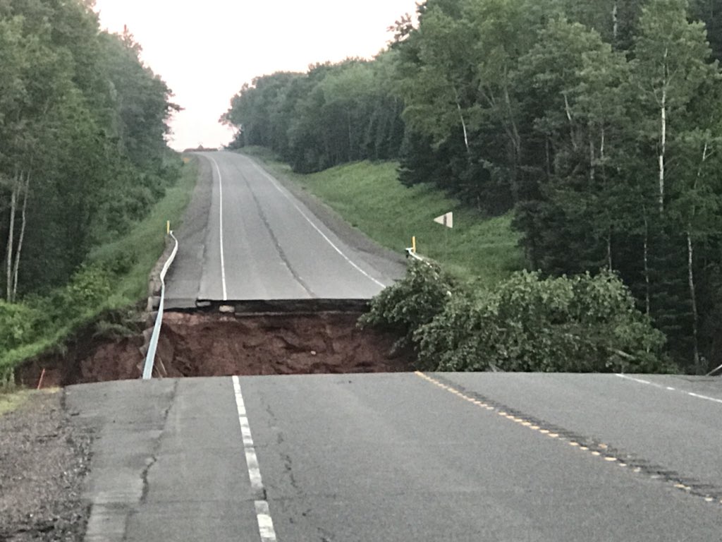 LaurenKalil's tweet photo. We’ve headed up North where Governor Scott Walker has declared a state of emergency for several counties. Here is a washout in Bayfield County. We’re about 20 miles Southwest of Washburn on U.S. highway 2 #stormdamagecoverage https://t.co/Sw4Ipm7Uxa
