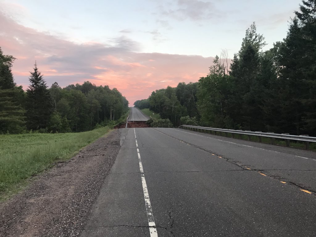 LaurenKalil's tweet photo. We’ve headed up North where Governor Scott Walker has declared a state of emergency for several counties. Here is a washout in Bayfield County. We’re about 20 miles Southwest of Washburn on U.S. highway 2 #stormdamagecoverage https://t.co/Sw4Ipm7Uxa