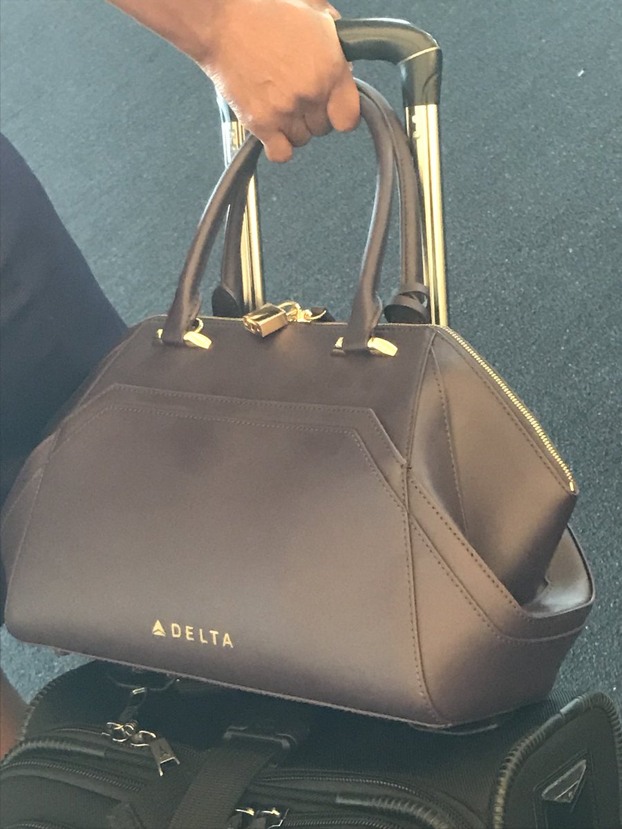 RamblingConsult's tweet photo. They even made purple branded purses! #deltareadyfortakeoff #TravelTuesday https://t.co/UTHU17wyix