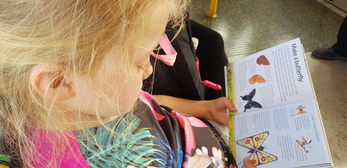 Lucyyamaha's tweet photo. She just loves #sensationalbutterflies at @NHM_London. Every time we see more new ones! I'll post some her shots later. She's just doing a bit of reading about them on the train home. #photography #typical7yearold not. #autismawareness https://t.co/Y9UgvcfEuT