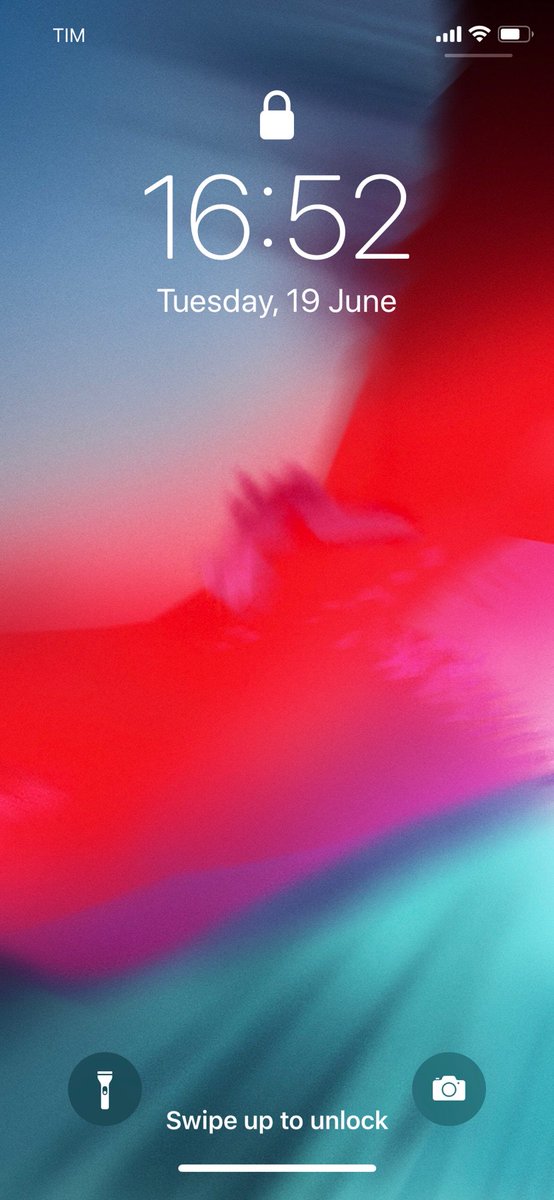 "An explosion of crimson rips asunder blue-green fractal generatives masquerading as paint striations."

☝🏻 That's the accessibility description for the iOS 12 wallpaper