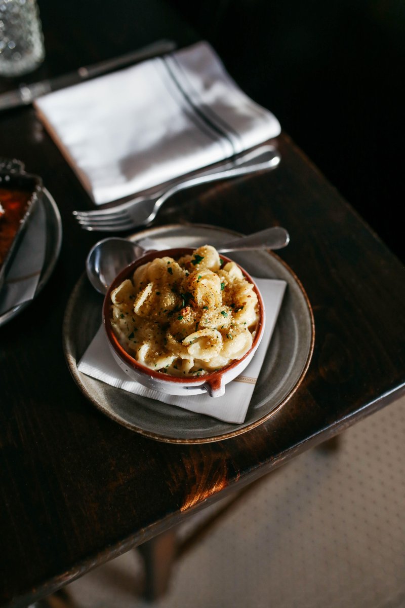 Shells and cheese has never looked (or tasted) so good. Made with orecchietti, aged cheddar, parmesan, gruyère, and herbed bread crumbs. Come drop in for our tasting hours, 5 p.m. - 7 p.m, to get scaled-down versions of popular dinner dishes, like this one! #eberlyatx