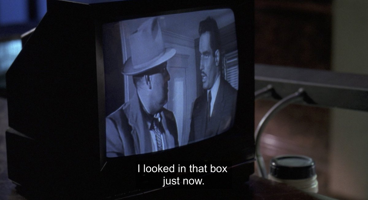 the security guard watching TOUCH OF EVIL is masterful foreshadowing in SNEAKERS