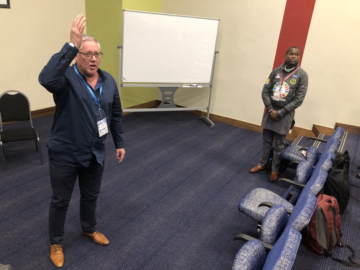 scheuster's tweet image. “If your butt is numb, your brain is dumb.” - @gavinkeller, as he makes everyone in the room stand, on the fundamental role of movement and play in learning (and the evidence we find in physiology). #ImpactAfrica18 #ChangemakerEd cc @LEGOfoundation @EinhornTrust
