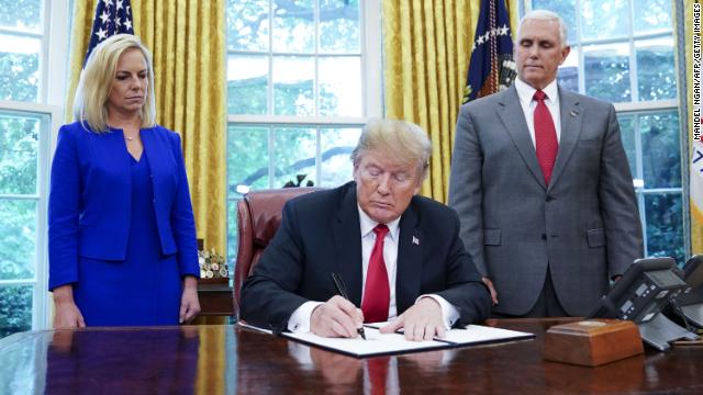 cnnbrk's tweet image. President Trump signs an executive order to keep families together at the border, reversing his position that he has no authority to do so cnn.it/2te9WeA