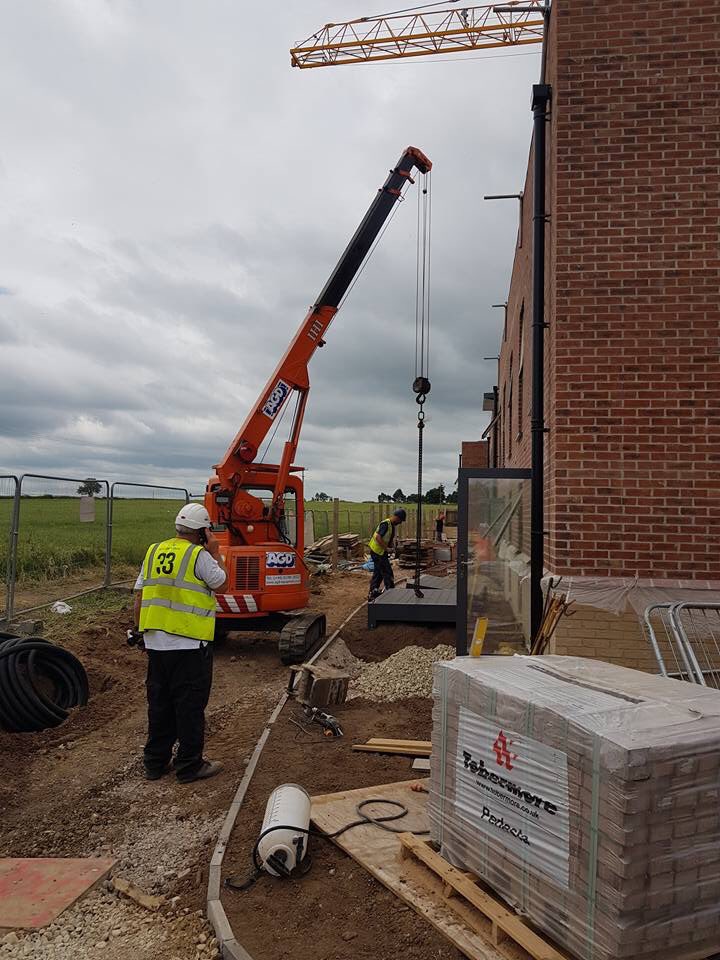 AGDEquipment's tweet photo. One of our IHI CCH30T 3 tons #ZeroSwing #MiniCranes lifting balconies in our home town of Stratford-upon-Avon, #Warwickshire for W&G Metalwork https://t.co/thb9TBQU3w