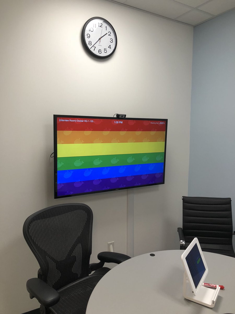 i_am_davidf's tweet photo. One of the many things I love about working @Docker - “inclusive, open culture” isn’t just a thing we say. It’s real. Every monitor in every conference room is a rainbow 🌈 this week! 🏳️‍🌈❤️ https://t.co/4M1sapIO37