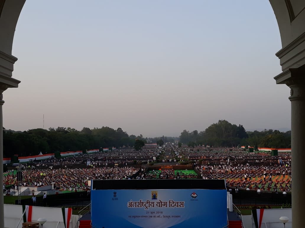 PMOIndia's tweet photo. Yoga Day greetings! 

In a short while from now, PM @narendramodi will be joining the Yoga Day programme at the FRI campus in Dehradun. https://t.co/7nyw3Xg92l