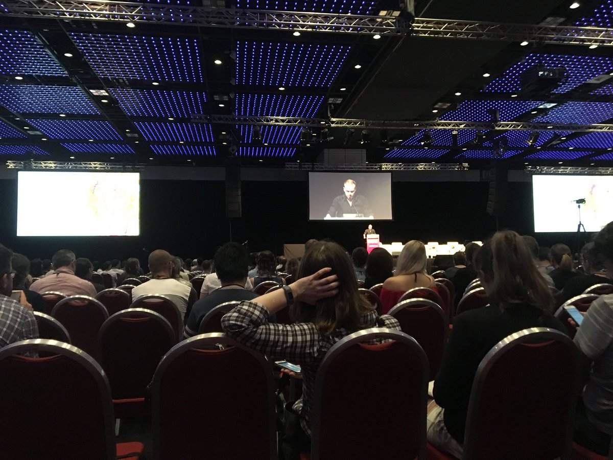 Last keynote of #OHBM2018 from @martijnheuv is engaging with audience participation (impressive in this giant hall). What are principles of human brain connectome? Wiring favors parsimony, but rich, central hubs (functional, neuronal) across networks may be precursors to disorder