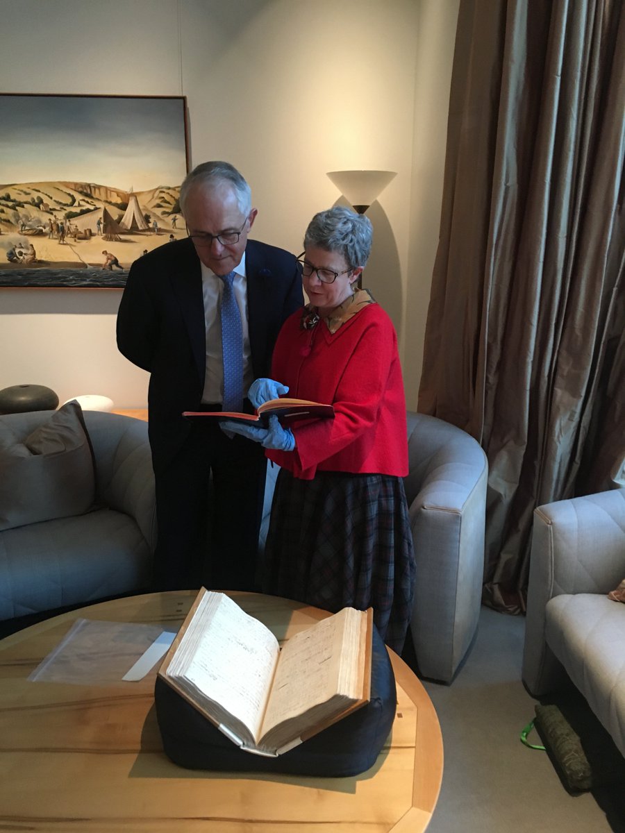 nlagovau's tweet photo. The day our No 1 treasure, James Cook's handwritten Endeavour Journal, sailed into the PM's office - under the watchful eye of our captain, Marie-Louise Ayres. Thanks everyone for making #ParliamentaryShowcase  such a success. @TurnbullMalcolm #nla50 https://t.co/5mwn5MbMG7