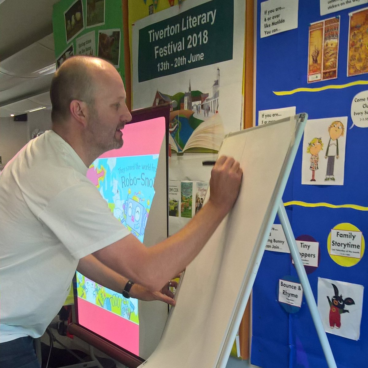 ThePaulCherrill's tweet photo. Caught in the SNOT FEST!! FAB time @TivLibDevon for the #RoboSnotLive @TivertonLitFest event. Storytime, scribbles and sing-a-longs. Thx @AmySparkes for being my partner in SNOT. Thx #RachelGee and all other event organisers @scholasticuk @Exeter_Hour @Devon_Hour @EditorEmma https://t.co/7v6gyK5uOY