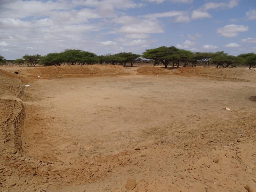 CPD_Africa's tweet photo. Rehabilitation of strategic water pans in #Adado courtesy of @diakoniekh @ACTAlliance support. More than 100 beneficiaries including women took part in the exercise putting food on their tables through the Conditional Cash Support. @OCHASom @GermanyinSOM @GermanyinKenya https://t.co/hB1RTWAzTy
