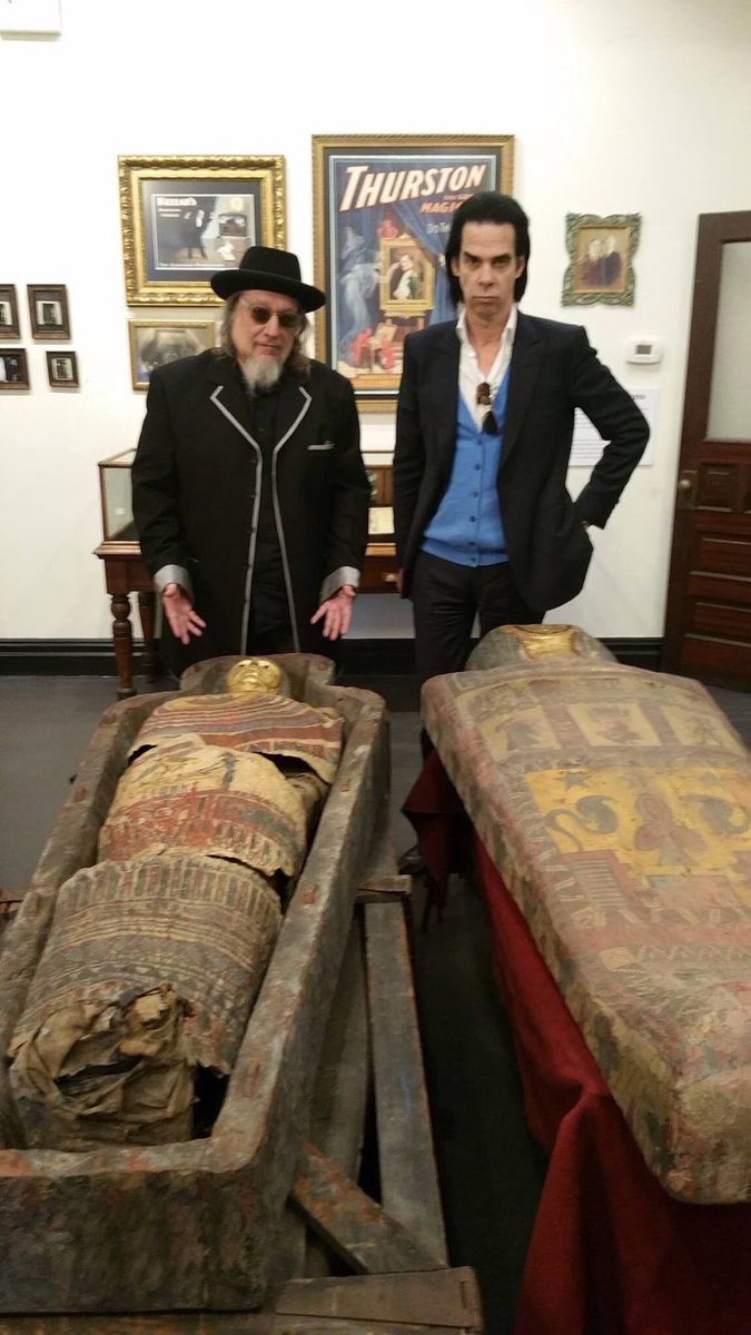 cavethings's tweet image. nick cave hanging out by mummies
