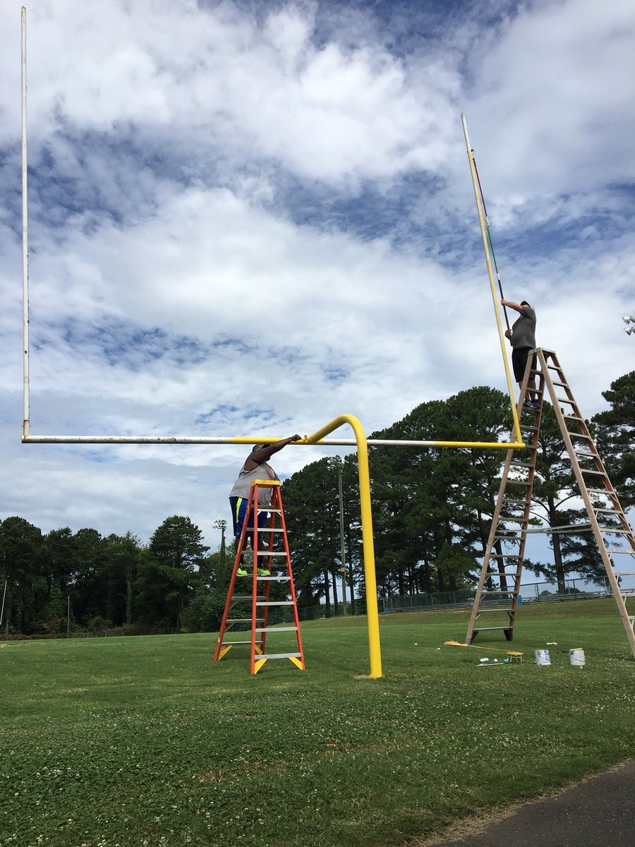 HighlandGaston's tweet photo. Our own @HighlandTechAD and Asst. Coach Bowden are hard at work repainting our field goal posts today. Great work, gentlemen! #HSTRocks #HighSchoolFootball https://t.co/pZYKu2QdIT