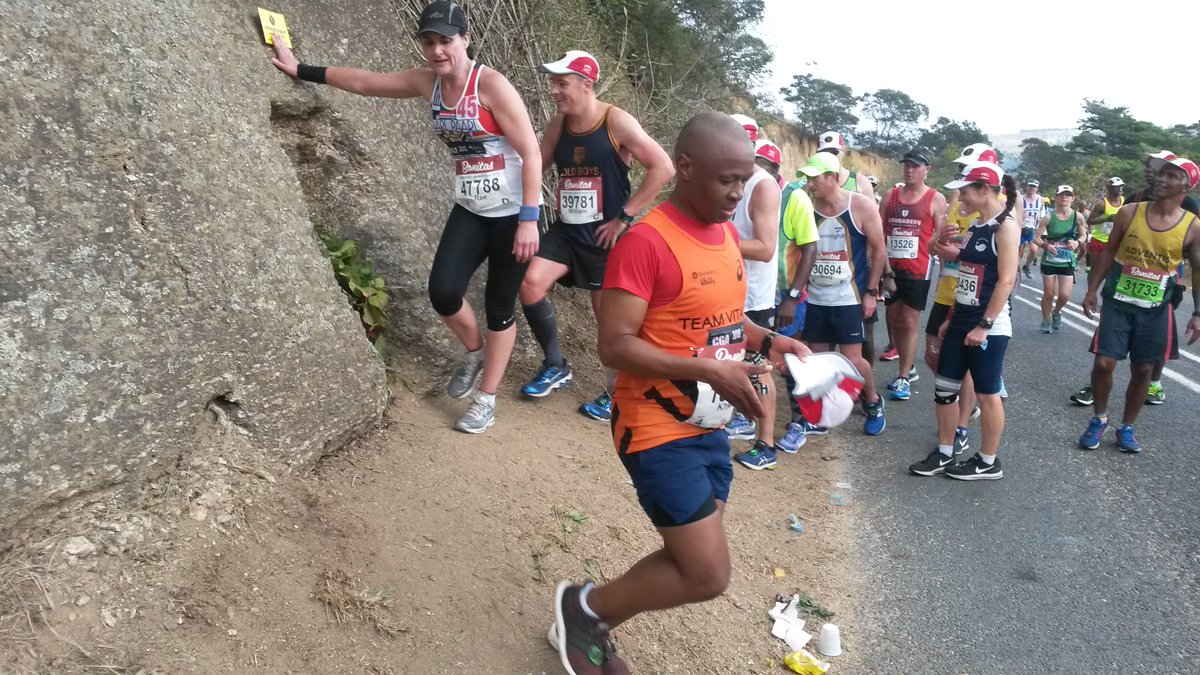 runningmann100's tweet photo. Arthur's Seat is 1/2way through #Comrades. Named after 5 time winner Arthur Newton, legend has it that if you greet him and place a flower on his seat he'll grant you a good 2nd half. In the run-up I forgot to find a flower. I gave him a leaf instead. Arthur doesn't like leaves. https://t.co/b5TPHFhnva
