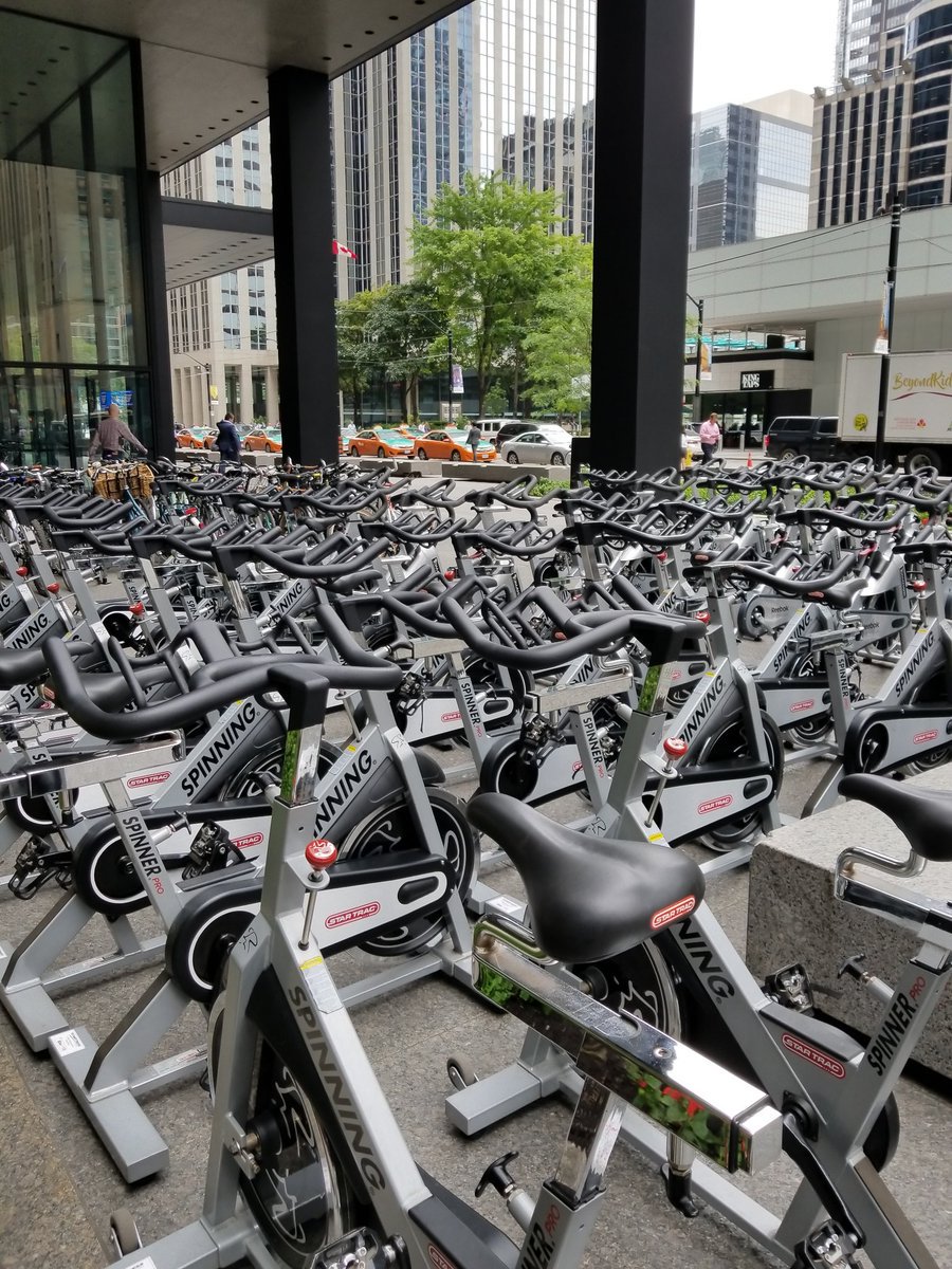 davidvisentin1's tweet photo. Teams of riders taking turns on 248 spin bikes! @bikefortykesTO  (2 pictures lifted from @ctcacf tweet of earlier set up.) https://t.co/fMUDDp14tQ