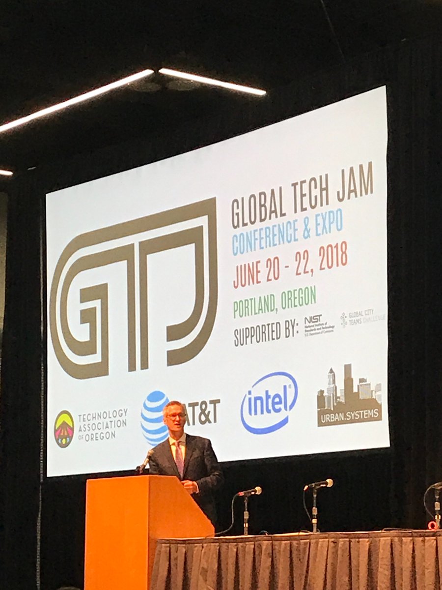 Summit_Strat's tweet photo. Portland Mayor @tedwheeler gives opening remarks emphasizing equity in their smart city strategy while opening day 2 of the #globaltechjam18 #techjam https://t.co/SSPISLLPyb
