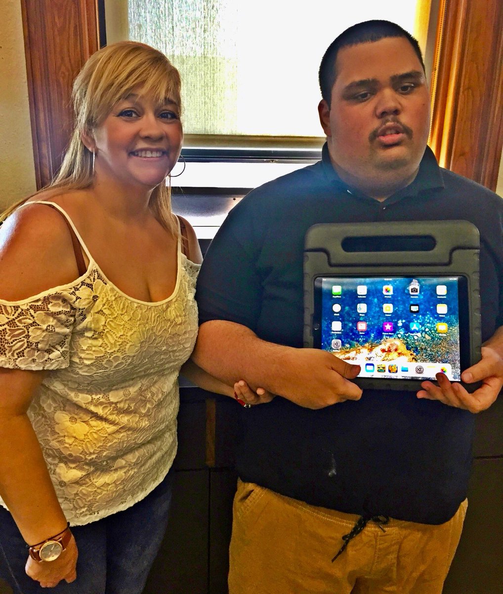 SESHighSchool1's tweet photo. Michael from our SLC program received a grant from the Doug Flutie, Jr Foundation for Autism. Because of them he was able to buy an iPad w/ applications that help enhance his communication at home &amp; school.  Michael is pictured with his mother. https://t.co/Kp9HwUOlH8