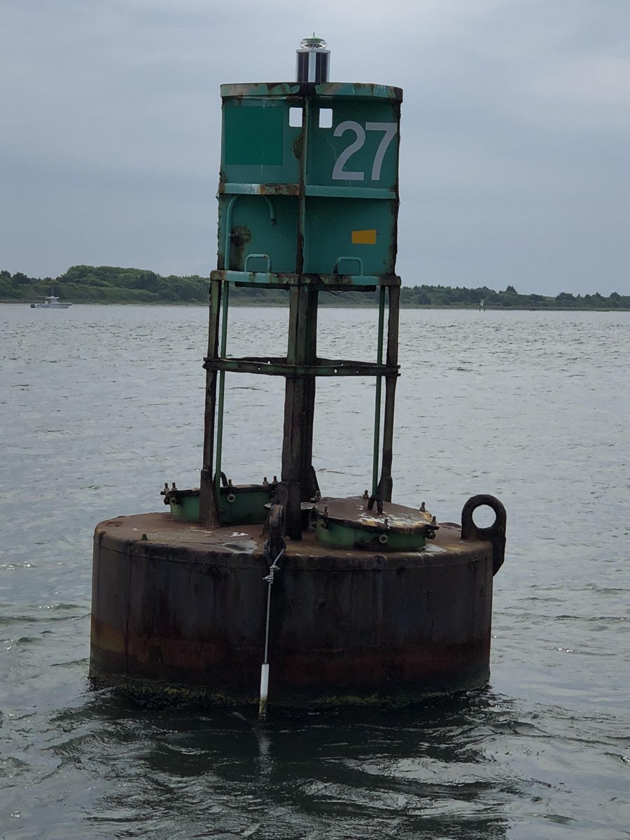 Hanging from the navigation buoy is a stainless steel cable/PVC pipe that contains a receiver used to track movements of electronically-tagged fish. Gathers critical data for understanding wild fish population movements and survival. 
@CMAST_NCSU