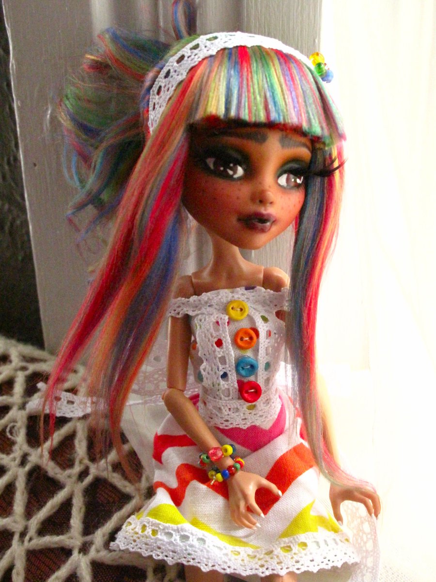 AmBorisenko's tweet photo. Here is my new doll! I wanted her to be very colourful and I wanted to try a more expressive eyebrow. I'm quite proud of her dress, I sewed it by hand without a pattern, and I made the buttons out of polymer clay! #mhrepaint #ooakdoll #rainbow #dollcrafts #dollrepaint #custom https://t.co/Lle2fpkf4T