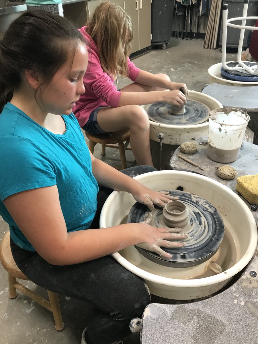 Tecumsehartists's tweet photo. Past, present and future artists working together on the wheel. So much fun to watch the learners I taught help teach the middle school clay campers! https://t.co/f4Lx7tiviP