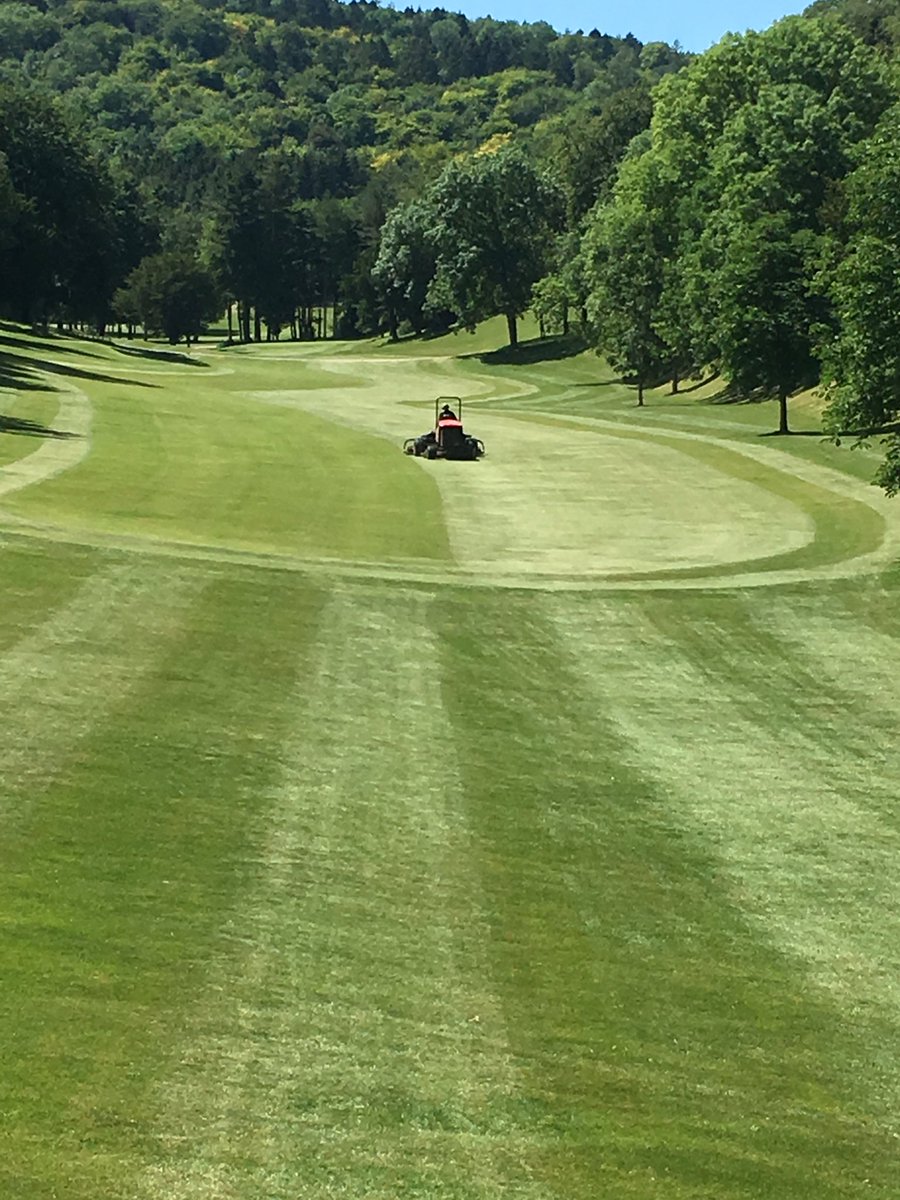The Greenkeeper's hard at it in preparation for Captains Day tomorrow.They really are doing a great job and the course is absolutely stunning! #topjob