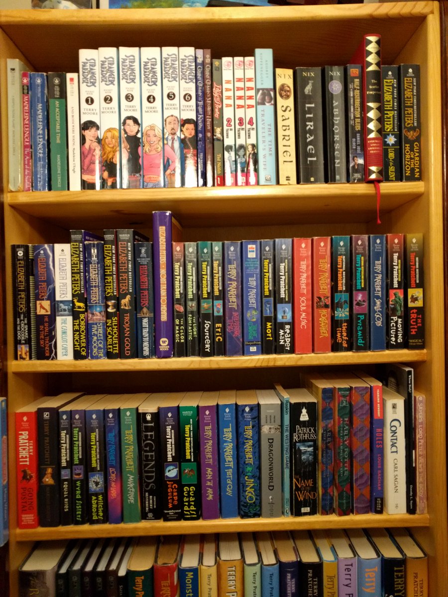 midlibraryorg's tweet photo. As promised, part 2 of Jenny's collection for our #MIDBookShelfie series! This set has some of my own favorites - especially the Terry Pratchett Discworld novels <3 Post your own #BookShelfie and tag us! #MidPubLib https://t.co/UE6GJxmL9d