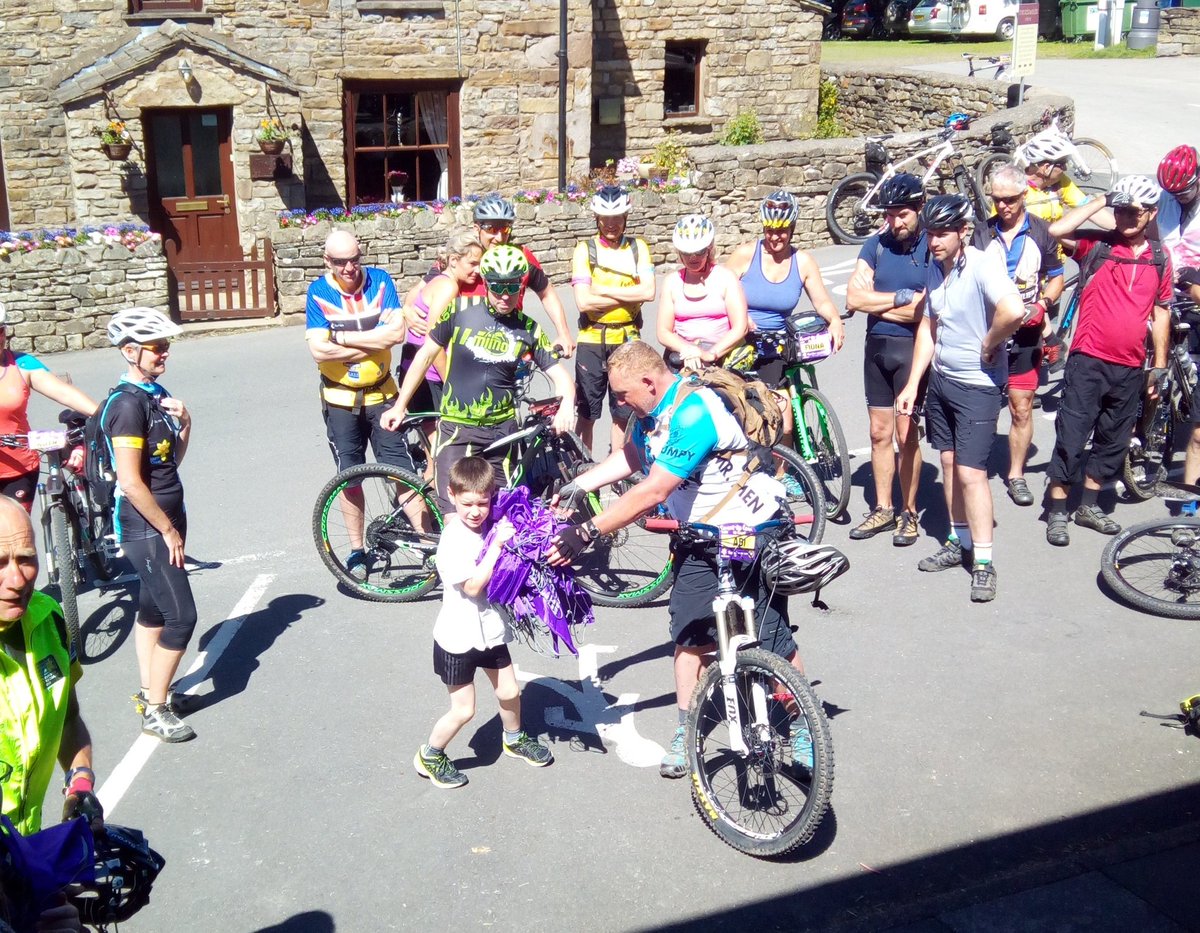 Cyclists being cheered on as they pass through Dent. Raising money for Marie Curie. #coasttocoast2018