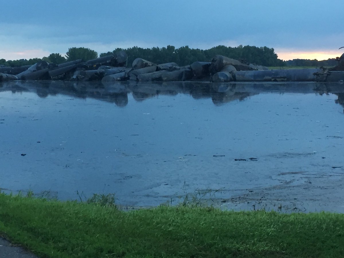 BartmanFarms's tweet photo. Train derailment by Doon, Iowa... what a disaster.... tankers full of oil spilling into flood waters.. pictures from @Jake_fabe https://t.co/BU6yI6JYQI