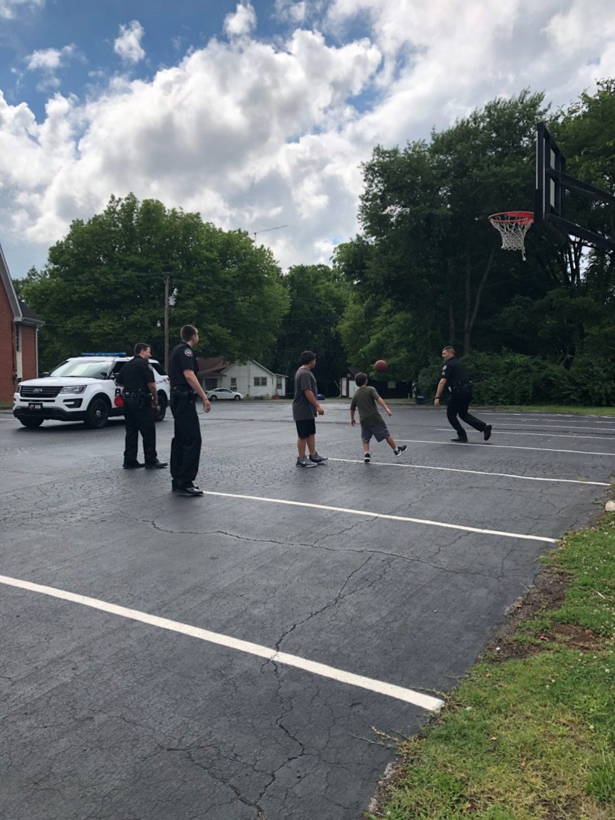 wkupd's tweet photo. Sgt. Humphries, Ofc. Wallen, &amp; Ofc. Arroyo out hooping it up with some neighborhood kids waiting for Bible Study to kickoff.
#CommunityMatters 
#communitypolicing https://t.co/JnkRsv91k1