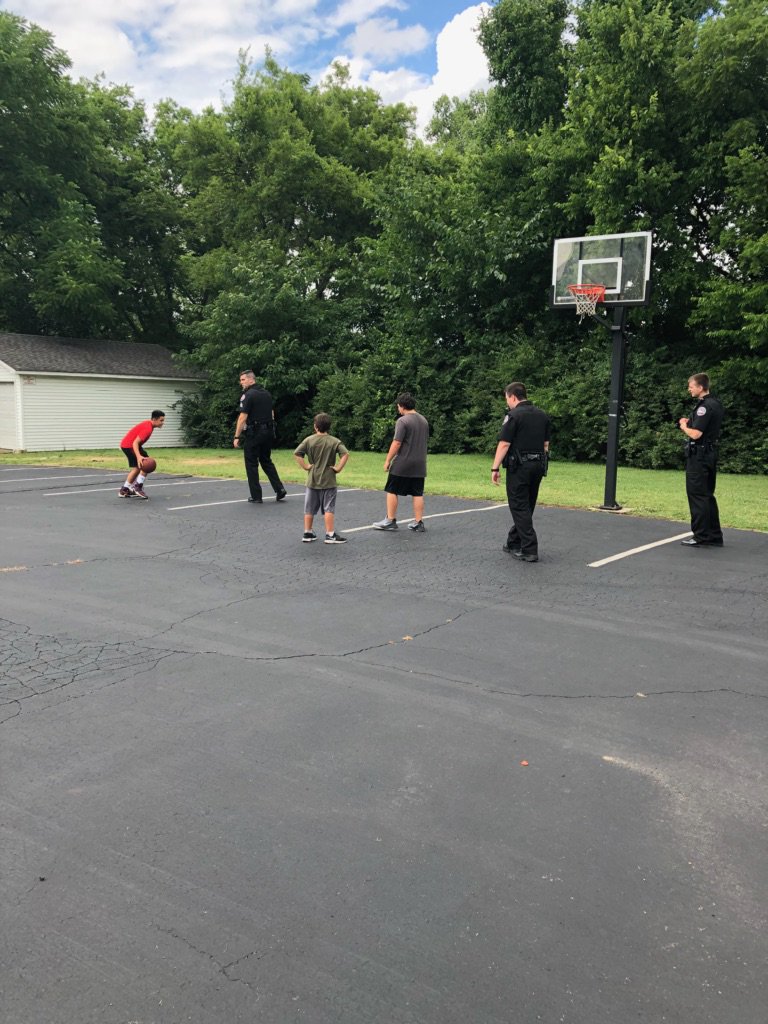 Sgt. Humphries, Ofc. Wallen, &amp; Ofc. Arroyo out hooping it up with some neighborhood kids waiting for Bible Study to kickoff.
#CommunityMatters 
#communitypolicing