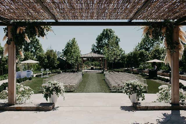 The rows of white chairs blend in nicely with the overall design of this ceremony to keep it natural and modern. || Planning + Design: <a href="/therheefined/">Rheefined Company</a> | Photographer: <a href="/baylymoore/">Bayly & Moore</a> | Venue: <a href="/carnerosresort/">Carneros Resort</a> | Tabletop + Chair Rentals: @theonicollection | Table Rentals: <a href="/brighteve/">Aoife Myler</a>…