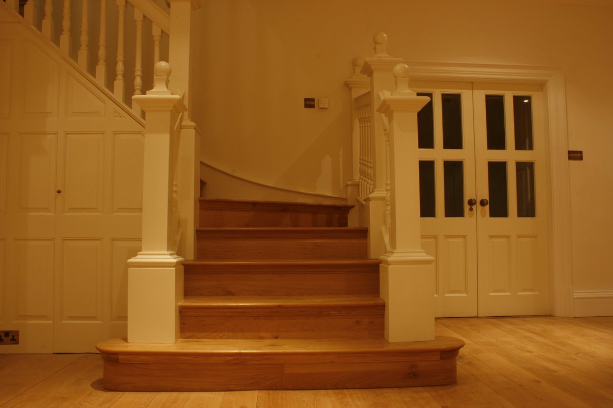 Staircase, doorway, English oak flooring and painting by SDB Designs. Everything executed by my company and staff, from design, building, fitting and finishing touches, this stunning white staircase with English oak treads and risers made especially for a client in Yorkshire