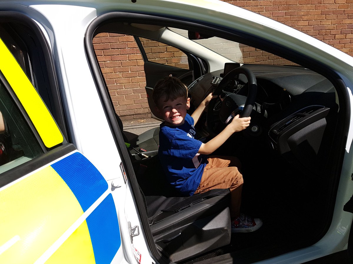 NWPWrexhamRural's tweet photo. New recruits Riley and Mason testing the #Chirk police car at @YWaunChirk Summer fair. #NWPolice #pcsodean https://t.co/ZgOMBA1aJU