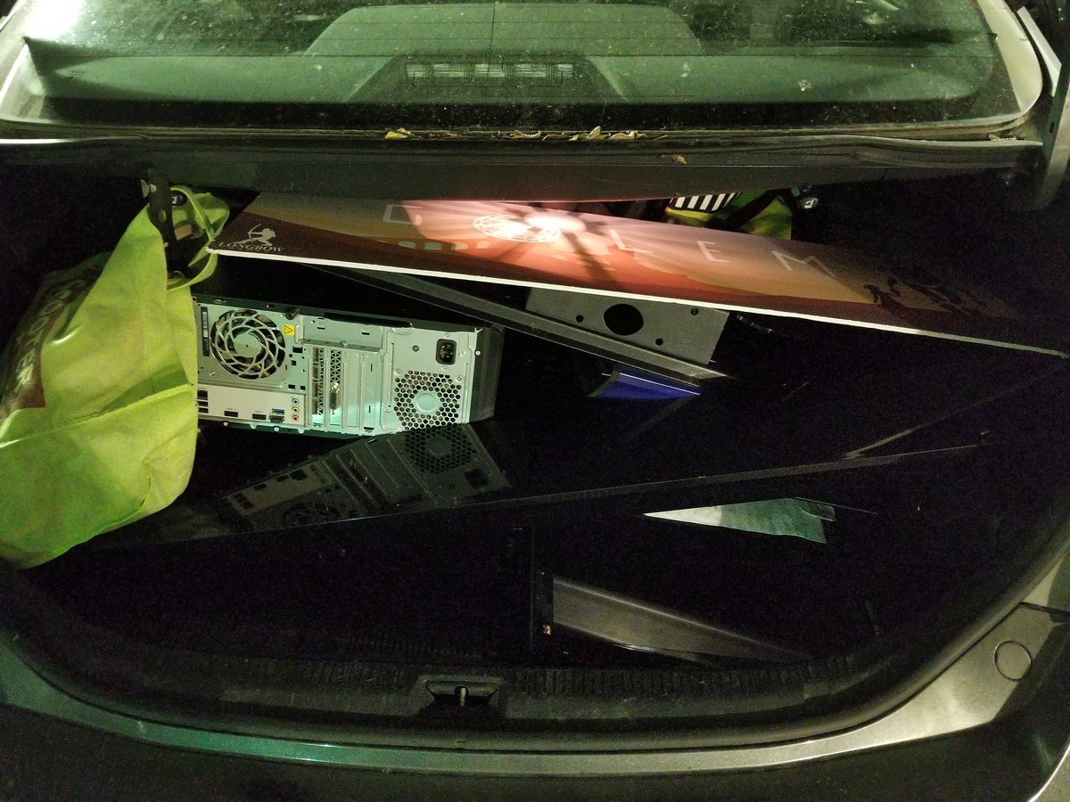 The answer to the most important question of the day ... will two 30+ inch tvs, a 5ft tv stand, 2 pcs and assorted cables, posters and accessories actually fit in the tiny trunk of a 10 year old hybrid? ... to our relief the answer seems to be yes