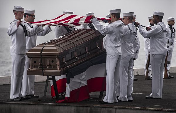 PACIFIC OCEAN (June 21, 2018) Sailors participate in a burial at sea ceremony aboard USS Carl Vinson (CVN 70).  (U.S. Navy photo by Mass Communication Specialist 3rd Class Dylan M. Kinee/Released)