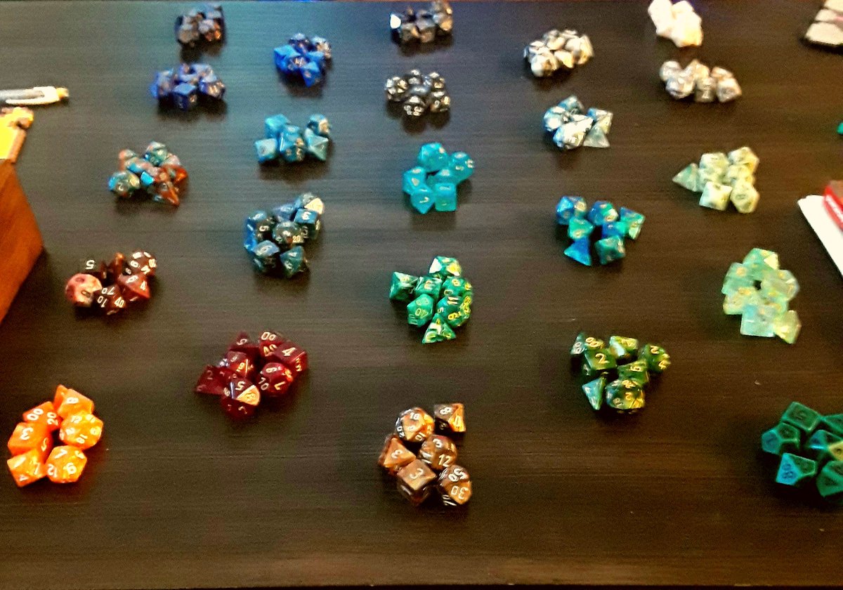 TonksHufflepuff's tweet photo. My dice collection. My boyfriend says I have a problem. My 23 sets of dice and I disagree. XD https://t.co/7avOi6Ddmb