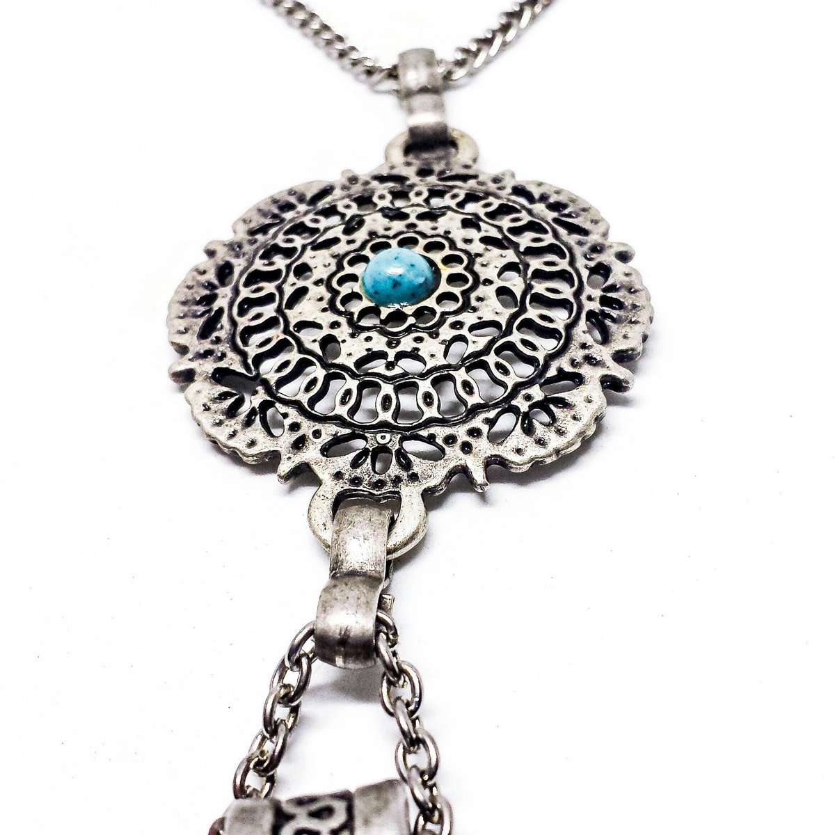 handvibesug's tweet photo. It's amazing how this pendant looks like right? All #silver through out with a tiny #bluestone at the center that looks #gorgeous, #pretty. #handvibesug #engravings #getitnow #metal #pendant #kampala https://t.co/e84Jhvti3A