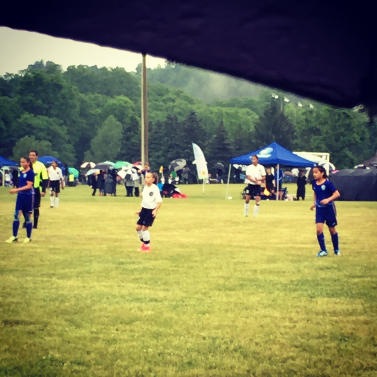 #Rainy morning in my #hood. Shout out to all the #soccer #moms out there! #saturday #dedication #teamwork #hoodieweather #soccermania #undermyumbrella #umbrella