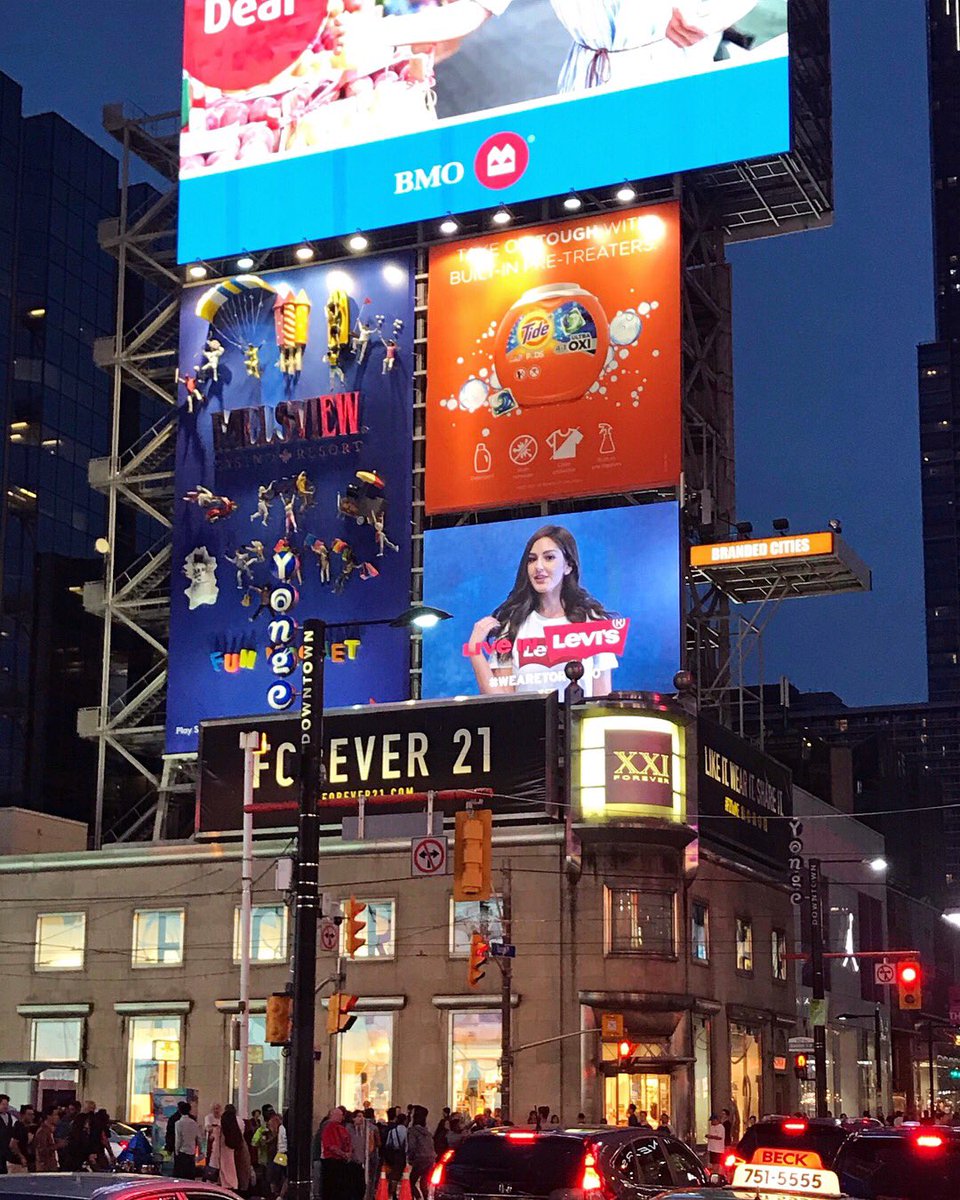 Oh hey...that’s me...ON A BILLBOARD IN YONGE AND DUNDAS SQUARE! 😱 So cool to be apart of the @levis #WeAreToronto campaign! 💙❤️💚💛