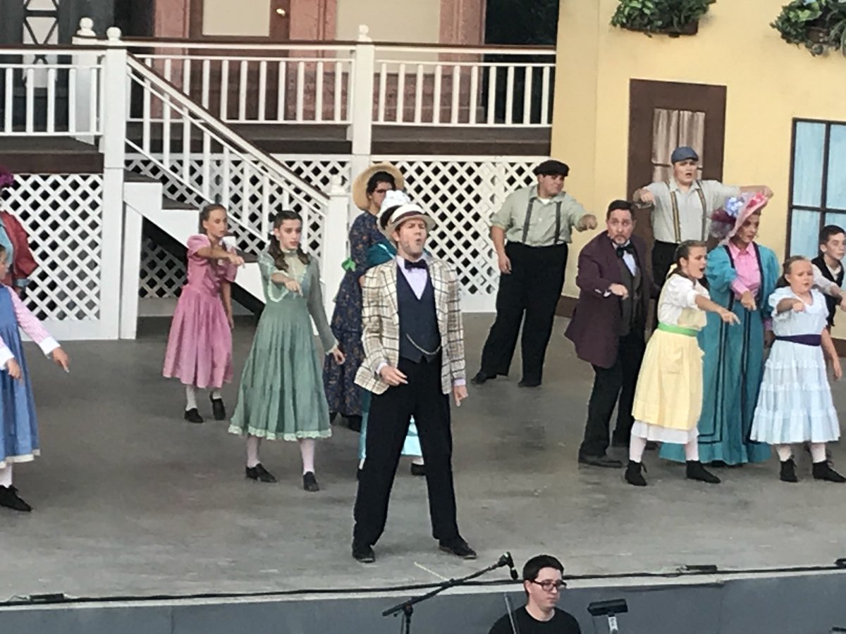 jackson_carrie's tweet photo. That’s my niece Sydney in the green dress right behind Professor Harold Hill. 😊#TheMusicMan #MoonlightMusicals https://t.co/nQcOyZm2Of