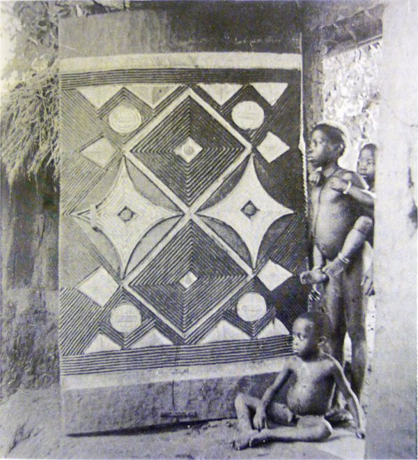 "Carved wooden door, Nri-Awka [Igbo], forming gateway into walled compound." G. I. Jones, 1930s.
