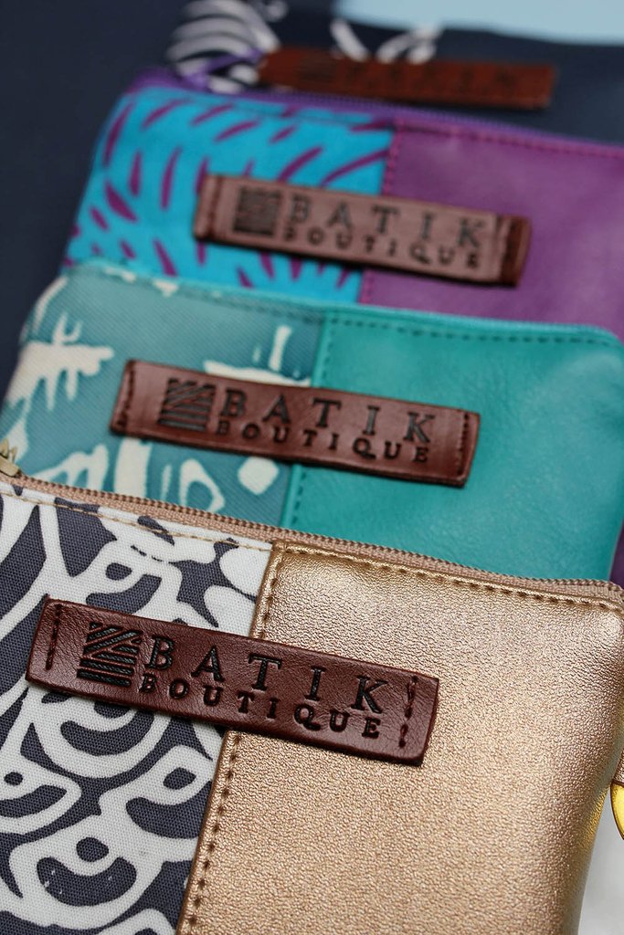 Have you seen our card holder wallets? We couldn't get enough Grey Peony, Turquoise Tikar, and Purple Rain batik prints, so we made more products! These are the perfect accessories for running a errands as they hold your keys as well as a pouch large enough for cards and cash.