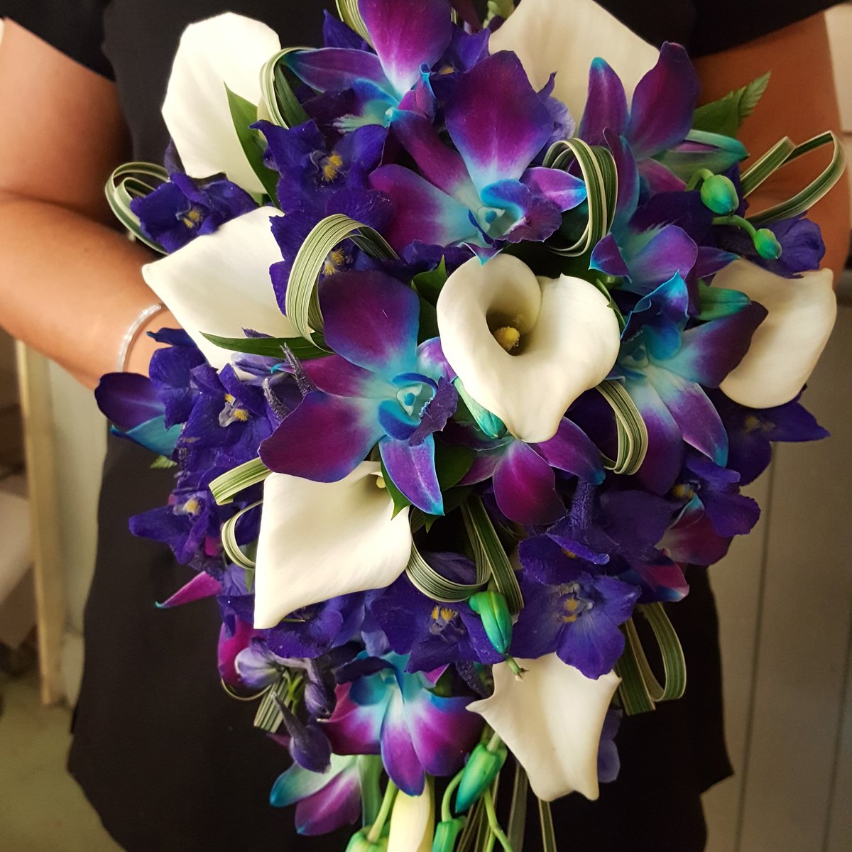 Beautiful bridal bouquet of Calla Lilies and Singapore Orchids. Stunning colours!