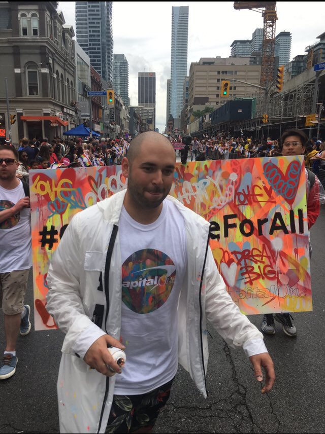 CapitalOneCA's tweet photo. Check out @ricciardipaints creating #art as we march with #Pride! #CapitalOneForAll https://t.co/NrxiFEVItg