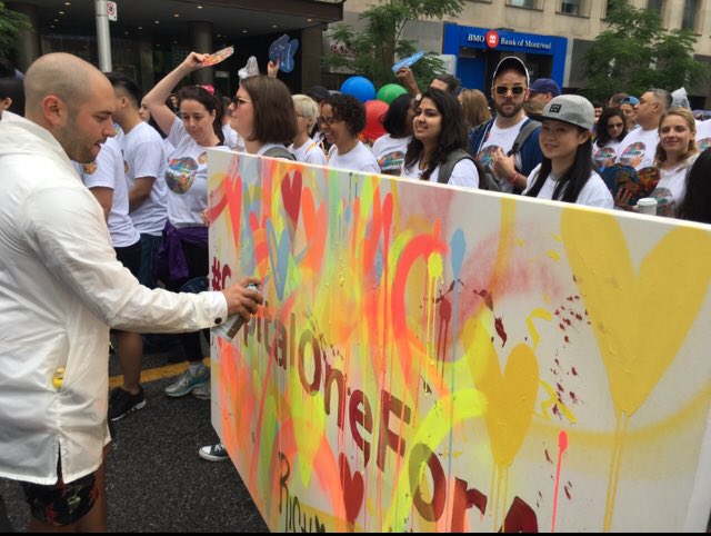 CapitalOneCA's tweet photo. Check out @ricciardipaints creating #art as we march with #Pride! #CapitalOneForAll https://t.co/NrxiFEVItg