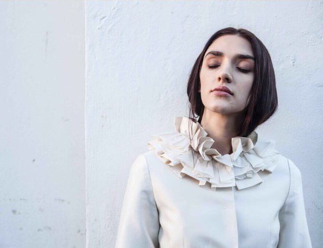 LisaRedmanLtd's tweet photo. Soaking up this beautiful sunshine while it hangs around 🌞 Bespoke Lisa Redman jacket with silk zibeline ruffles 🙌 https://t.co/RgD9hZrkBw