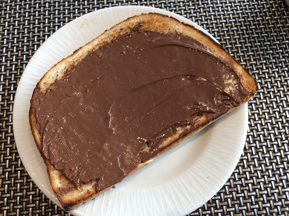 Spread Nutella on toasted bread for a simple but energy filling breakfast <a href="/nutella/">emanuele</a> #breakfast  #foodporn #cooking #studentcooking  #foodbloggers #foodphotography #foodpics #homecooking #foodlove #eatwell #foodstyling #foodforfoodies #toast #nutella
